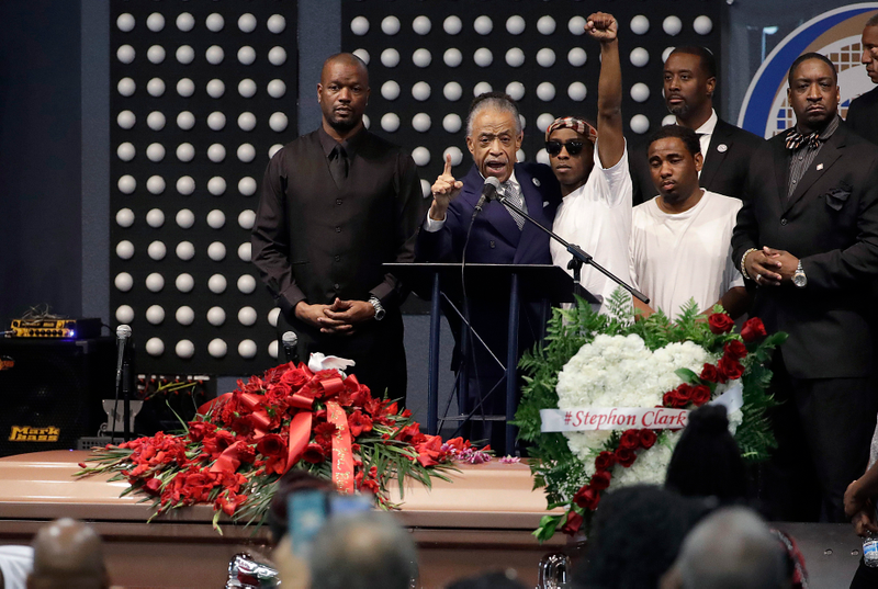 Rev. Al Sharpton (2L) speaks to Stevante Clark (arm raised) during the funeral services for police shooting victim Stephon Clark at Bayside Of South Sacramento Church March 29, 2018 in Sacramento, California.